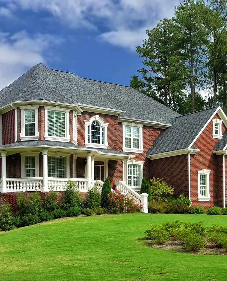 brick home with new roof